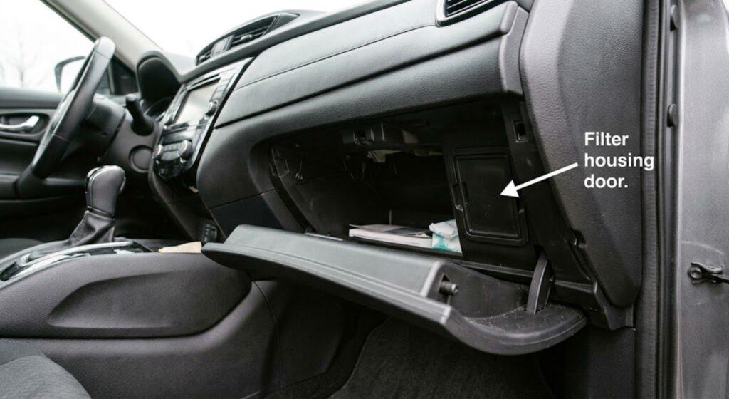 2017 Nissan Rogue glove box dropped fully open showing cabin air filter housing door on the right side of the cavity