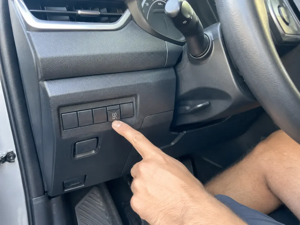 Toyota Corolla TPMS reset button location under lower dash