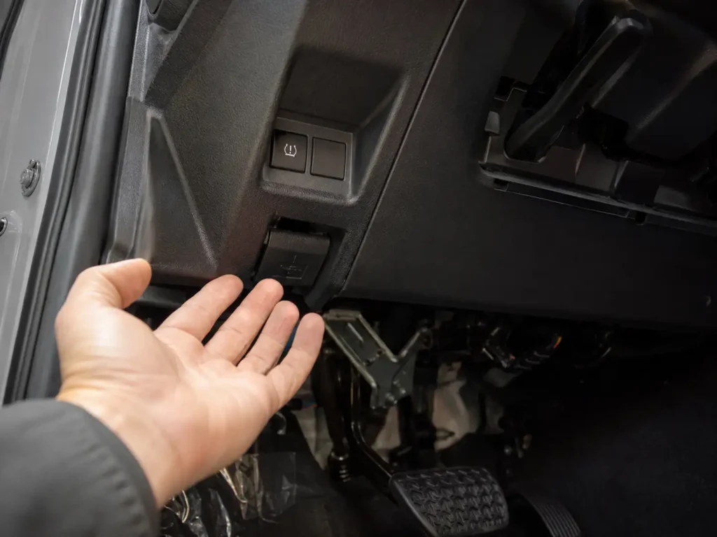Underside of 4Runner dash showing TPMS reset button location