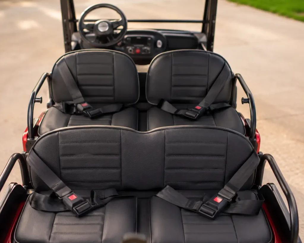 Four individual seatbelts on a 4 seater electric golf cart for kids